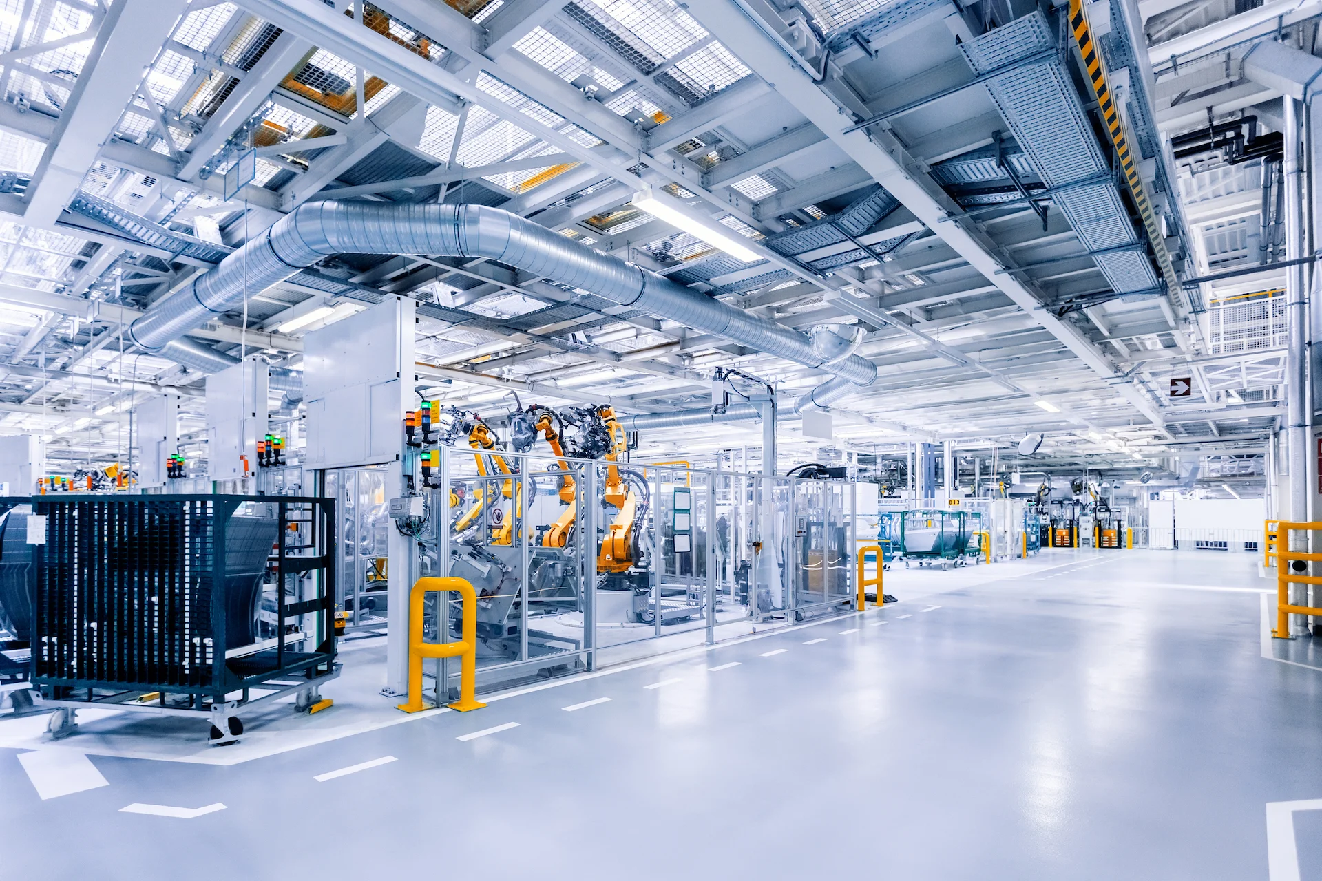 manufacturing facilities floor robotic arms in a car plant