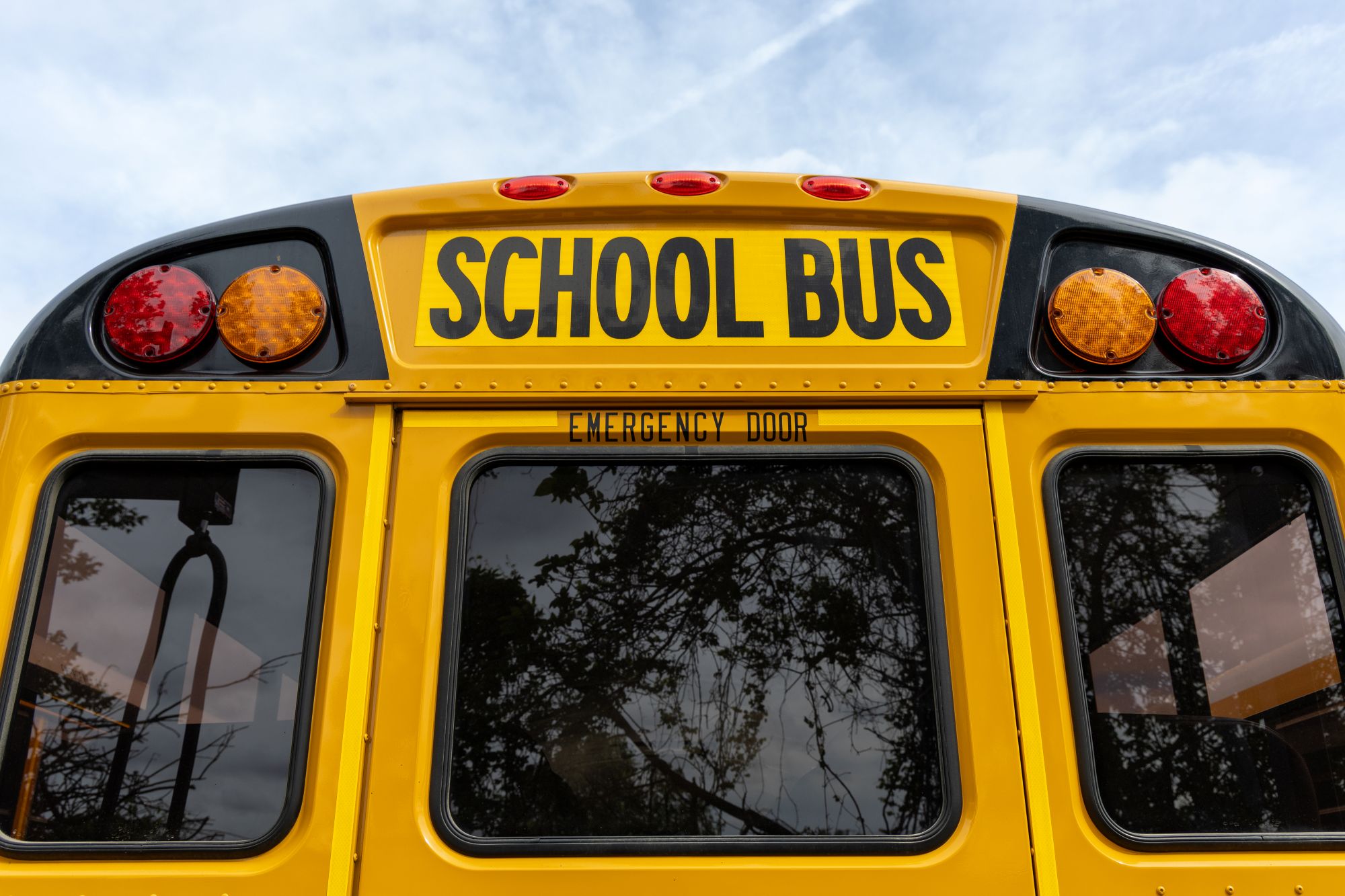Rear emergency exit and windows on a yellow school bus